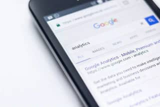 Phone screen on a google search page. Monetize your blog