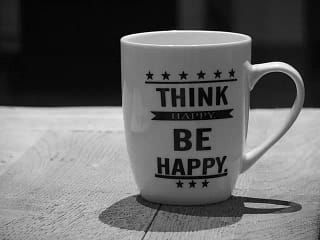 Mug that says "Think happy be happy"