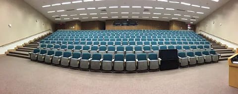 Empty auditorium class room with blue seats